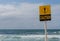 Caution sign at rough surf conditions in landscape format