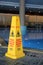Caution signs warning about slippery and wet floor in multiple languages