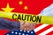 Caution tape over businessmen handshaking on Usa or American and China flags merged politic and economic relationships concept