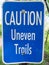 Caution Uneven Trails Sign