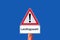 Caution warning sign state election on blue background in german