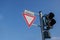 Caution and warning triangular sign with tram symbol and traffic light.