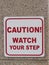 Caution watch your step sign