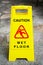 Caution wet floor sign on the walkway