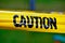 Caution yellow tape with black letters