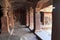 Cave 1: Interior view of a 18 pillared hall. Badami Caves, Karnataka. Ardhanarishvara sculpture on the left and a dancing Shiva on