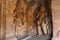 Cave 3 : Carved figure of Vishnu as Narasimha, half human, half lion, on the right and Harihara, a syncretic sculpture of Vishnu a