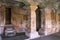 Cave 4 : Interior view. The figure of Mahavira in the sanctu is partially seen, Jaina Tirthankara images engraved on the pillars a
