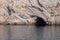 Cave carved by the ocean, seen from the boat