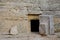 The cave is coffin for burial according to the ancient Jewish tradition. Large stone at the entrance to the stone cave