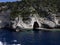 Cave on the dark blue sea in Paxos