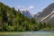 Cave Del Predil - Scenery of Lake Predil with panoramic view of majestic mountain peak Cinque Punte