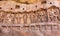 Cave with Hindu gods on historical relief. Arwork in Badami town, India. Temple carvings made in 6th century, Karnataka