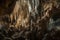 cave with intricate network of waterfalls and stalactites