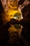 Cave lava tube illuminated with water reflection in Canary Islands