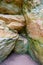 Cave in Licu - Lange rock, Latvia. Fragment of sandstone cliff.