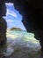 a cave next to a body of water on Malapascua Island in the philippines