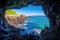 cave opening revealing a stunning ocean view
