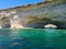 Cave passage with rocky seashore at Malta