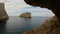 Cave on Rocky Coast with Cliffs on the Mediterranean Sea. Sardinia, Italy. Background.