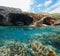 Cave on sea shore and fishes underwater Spain