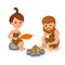 Caveman. Male kindles fire. Female cook the fish on the fire.