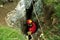 Caver descends in a cave