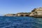 Caves and arches in the rock formations along the coastline, Algarve, Portugal.