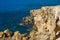 Cavo Greco cape on Cyprus. Travelling and vacation concept. Spectacular rocks on the Mediterranean Sea shoreline. Clean and blue