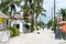 CAYE CAULKER, BELIZE - NOVEMBER 19, 2017: Caye Caulker Island in Caribbean Sea. Sandy Street with Local Architecture and People.