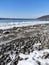 Cayuga Lake frozen waves and stone shoreline