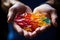 CBG Gummies. a person holding colorful candies in their hands