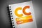 CC - Carbon Copy acronym on notepad, concept background