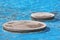 CCoseup of Concrete Stepping Stones in Blue Pool