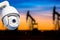 CCTV camera concept with silhouettes of oil well