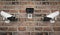 CCTV camera on the red brick wall. Set of different views. 3d rendering illustration