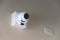 A cctv camera on wall inside the building for watches down below important events
