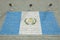 CCTV cameras and wall with printed flag of Guatemala. National surveillance system conceptual 3D rendering