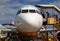 Cebu, the Philippines - 14 Nov 2018: Aircraft front view with passengers on stairs. Landed aircraft with ladder