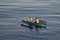 Cebu, Philippines - Circa April 2019: Traditional peaceful philippines fisherman on a wooden boat catching fish on a sunrise close