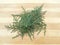 Cedar cypress leaf heap on wooden background