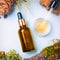 Cedar essential oil, pine in a glass brown bottle with a pipette. Flat lay, minimalism The concept of natural cosmetics.