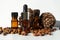 Cedar essential oil in small glass bottles on a white background. Cedar oil and nuts.