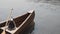 Cedar Strip Canoe on Lake with Oar and Fishing Net