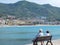 Cefalu, Sicily, Italy. May 10, 2017. A couple siting in the harbor of Cefalu