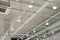 Ceiling with bright lights in a modern warehouse, shopping center building, office or other commercial real estate