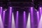 The ceiling of the concert stage with purple and white spotlights on the stage farm