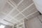 The ceiling is covered with plasterboard sheets during the repair process