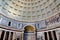Ceiling and the dome inside the Pantheon roman temple and catholic church in rome Italy.