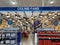 The ceiling fan and lighting aisle at Lowes home improvement store with hanging ceiling fans waiting for customers to purchase